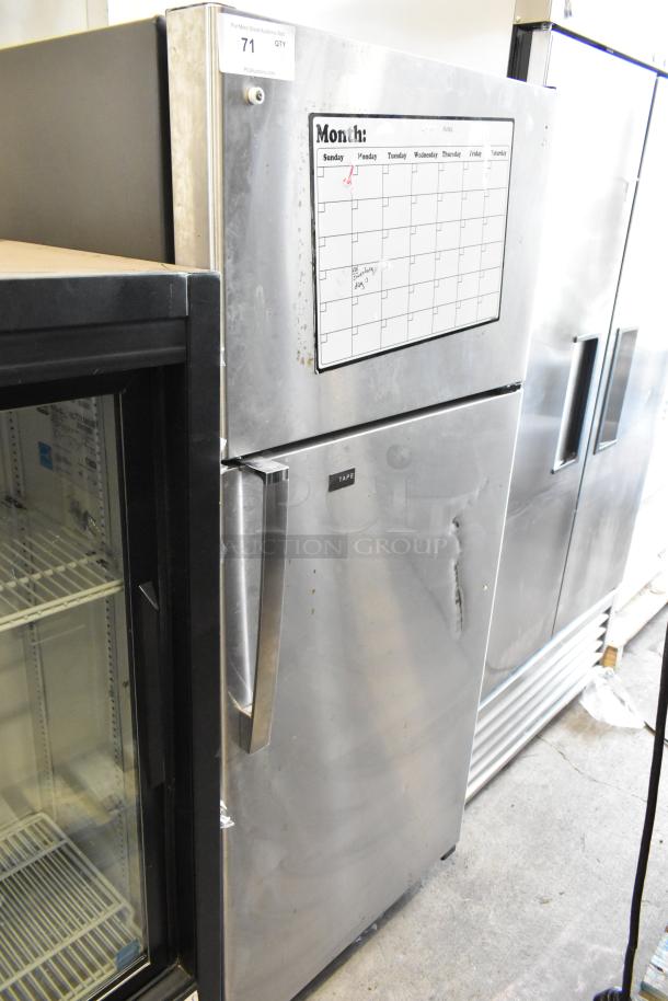 General Electric GE GTS17GSNDRSS stainless steel cooler with freezer, 115 volts, visible wear, upper dry erase calendar.