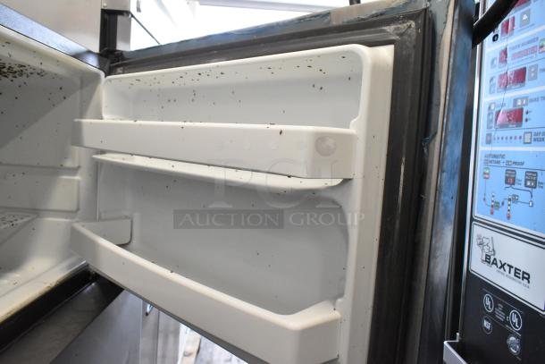 General Electric GE GTS17GSNDRSS stainless steel cooler with freezer, 115 volts, 1 phase, shows signs of use inside.