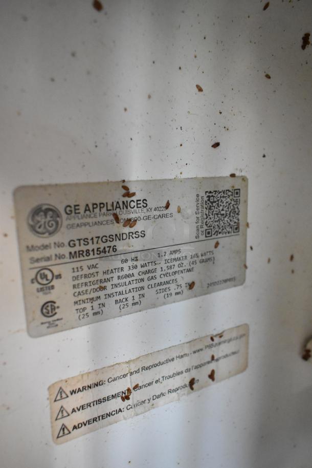GE GTS17GSNDRSS cooler label; details 115 volts, 1 phase, R600A refrigerant, and installation clearances. Visible wear.
