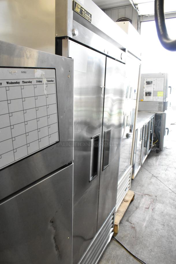 2016 True T-35 stainless steel commercial cooler. Two doors, poly-coated racks. 115V, 1 phase. Good condition.