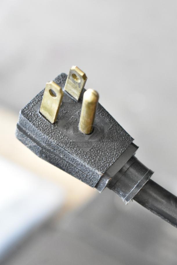 Close-up of a three-prong plug for the 2016 True T-35 commercial cooler, 115 volts, 1 phase.