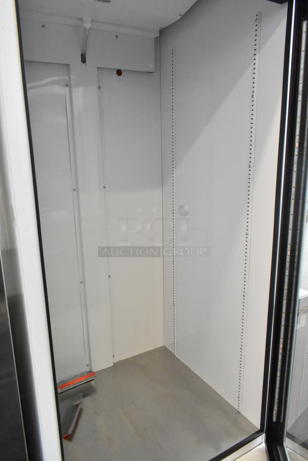2021 True TSCI-600R-G-PH commercial single door reach-in cooler with glass door, interior view, excellent condition. 115V, 1 Phase.