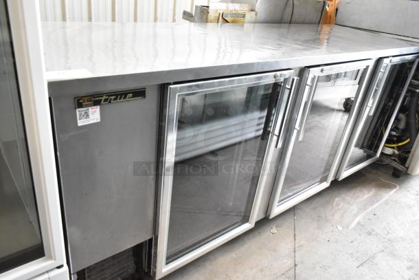 True TBB-4G-S-LD stainless steel 3-door back bar cooler on casters. Includes glass doors, 115V, 1 Phase, commercial use.