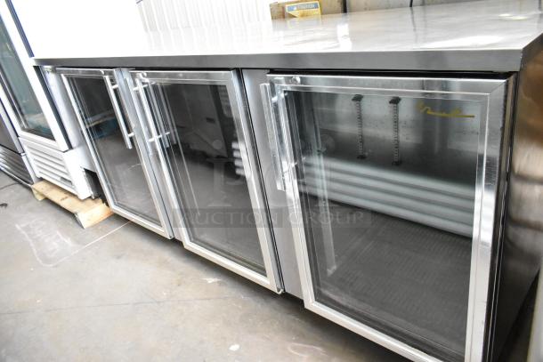 True TBB-4G-S-LD stainless steel back bar cooler with three glass doors, commercial casters, in good condition. 115V, 1 Phase.