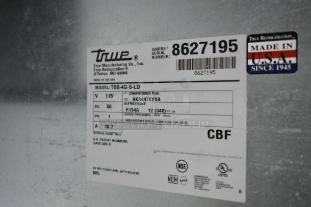 True TBB-4G-S-LD stainless steel commercial back bar cooler merchandiser label, 115V, 1 phase. Made in USA.
