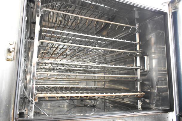 Rational SelfCookingCenter iCombiPro convection oven interior with stainless steel racks, in good condition.