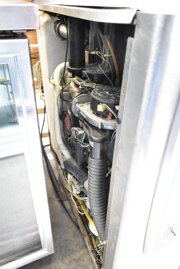 Interior view of a Rational SelfCookingCenter iCombiPro convection oven, showing wiring and components in stainless steel casing.