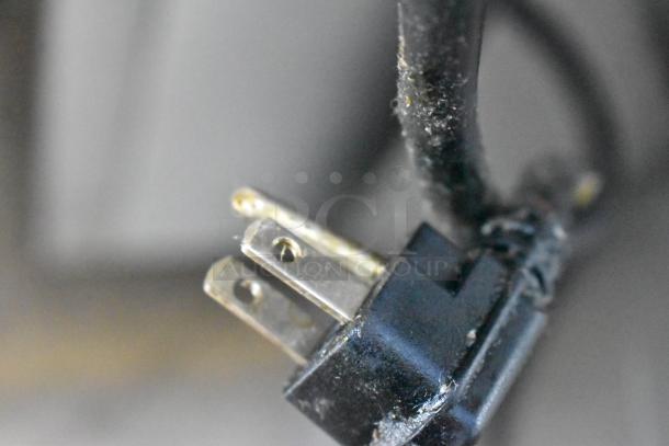 Close-up of a three-pronged power plug for the Atosa MGF8305GR prep table.