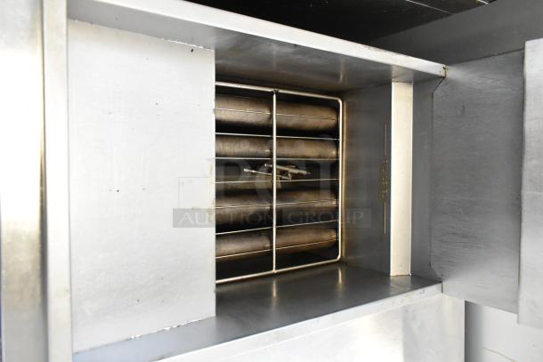 Cook Rite ATFS-50 stainless steel commercial deep fat fryer, 136,000 BTU, on casters, natural gas powered, interior view.