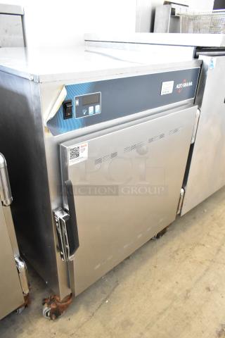 Alto Shaam 750-S stainless steel heated holding cabinet on casters, 120V, robust design, digital controls, visible labels.