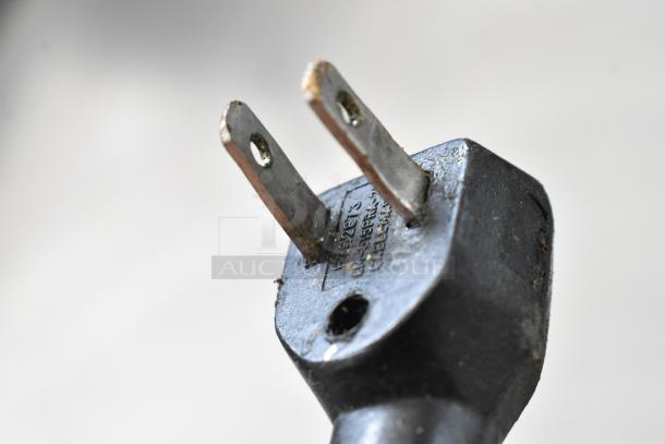 Close-up view of a power plug, showing details and prongs, part of the Alto Shaam 750-S holding cabinet.
