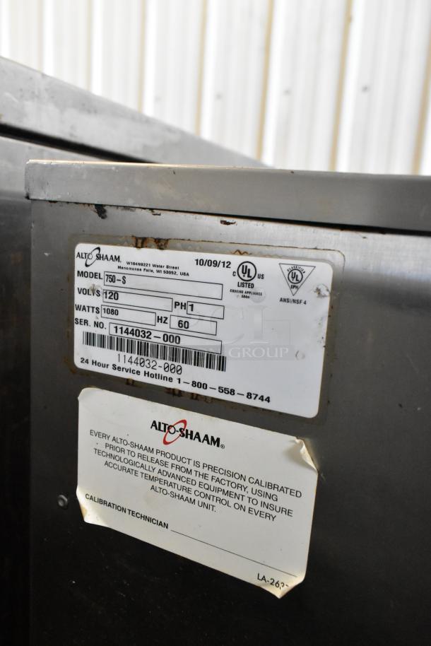 Alto Shaam 750-S stainless steel heated holding cabinet with tags, model 750-S, 120V, 1 phase, on commercial casters.