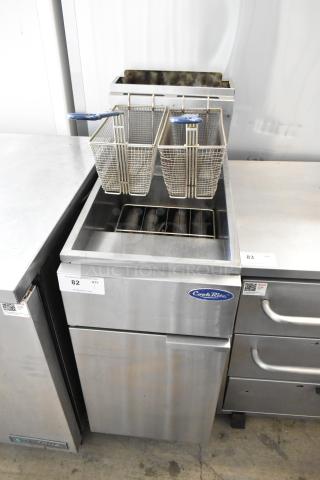Cook Rite stainless steel deep fat fryer with two metal fry baskets on commercial casters. Durable and ideal for high-volume use.