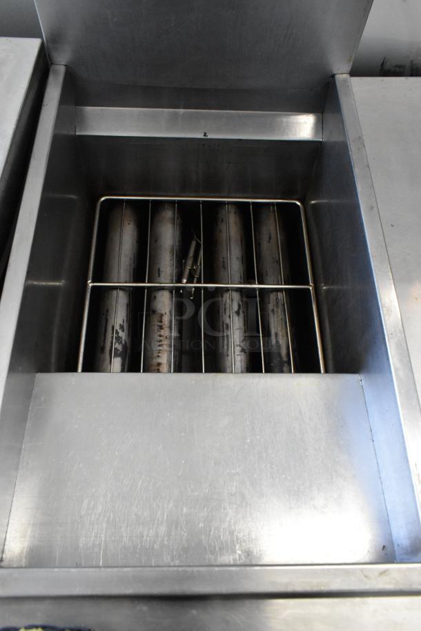 Cook Rite stainless steel commercial floor fryer, two metal fry baskets, on commercial casters, used condition.