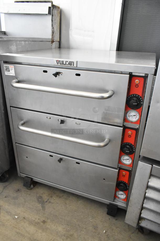 Vulcan stainless steel commercial warming drawer with 3 drawers, on casters, features temperature controls; good condition.