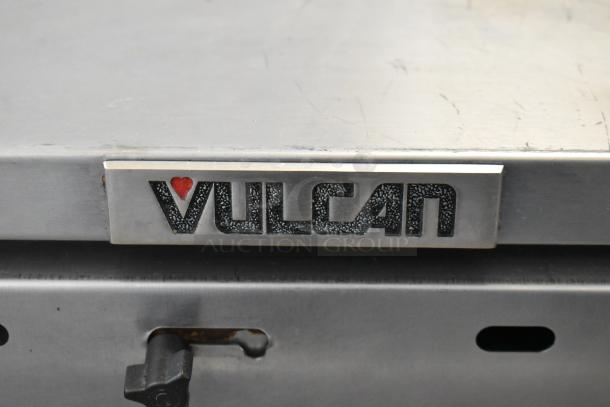 Vulcan stainless steel 3-drawer warming drawer with commercial casters. Features Vulcan branding. Good condition.