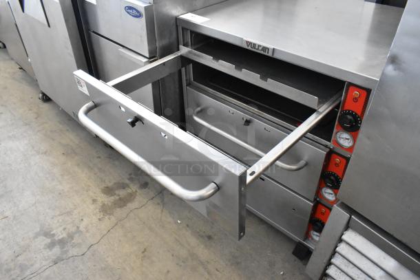 Vulcan stainless steel 3-drawer warming unit, commercial-grade, on casters, temperature controls visible, lightly used.