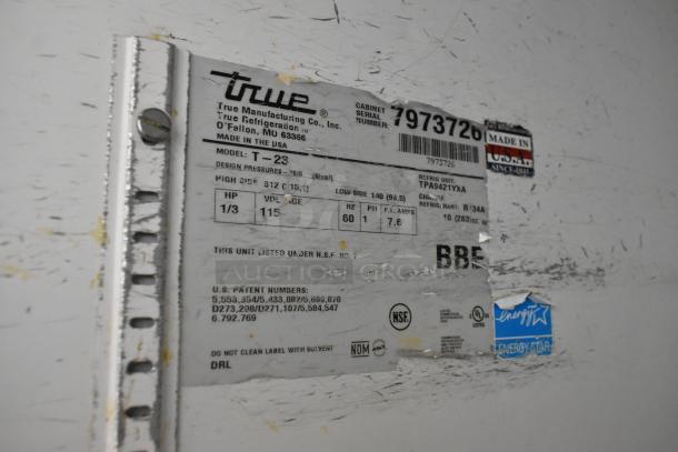 True T-23 cooler label showing model, 115V voltage, and certifications like NSF and Energy Star. Serial number: 7973726.
