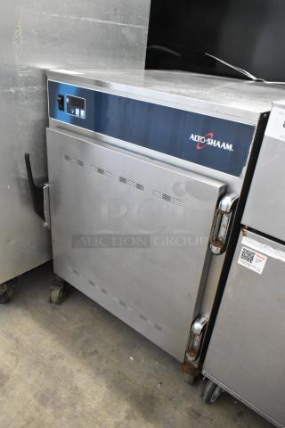 Alto Shaam 750-S stainless steel commercial heated holding cabinet on casters, 120V, 1 phase, visible wear, Alto Shaam logo.