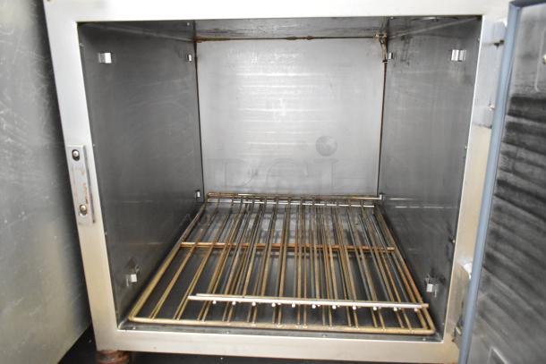 Alto Shaam 750-S stainless steel heated holding cabinet, interior view, on commercial casters. 120 volts, 1 phase.