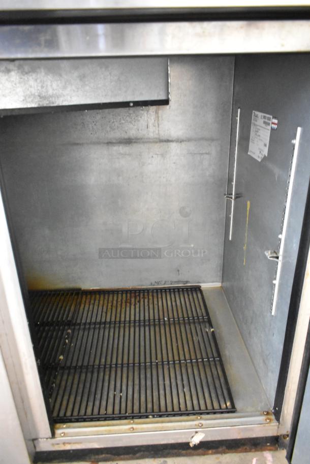 2016 True TBB-3-S stainless steel commercial back bar cooler, 2 doors, 115 volts, 1 phase, interior view, worn condition.