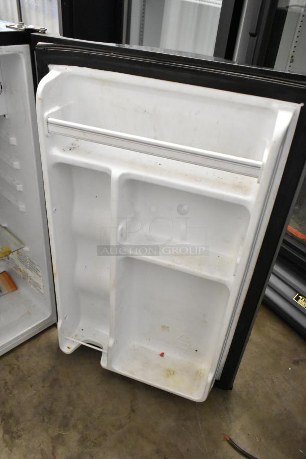 2020 Hisense RR44D6ASE mini cooler, visible stains and wear on inner door, 115 volts, 1 phase, model label intact.