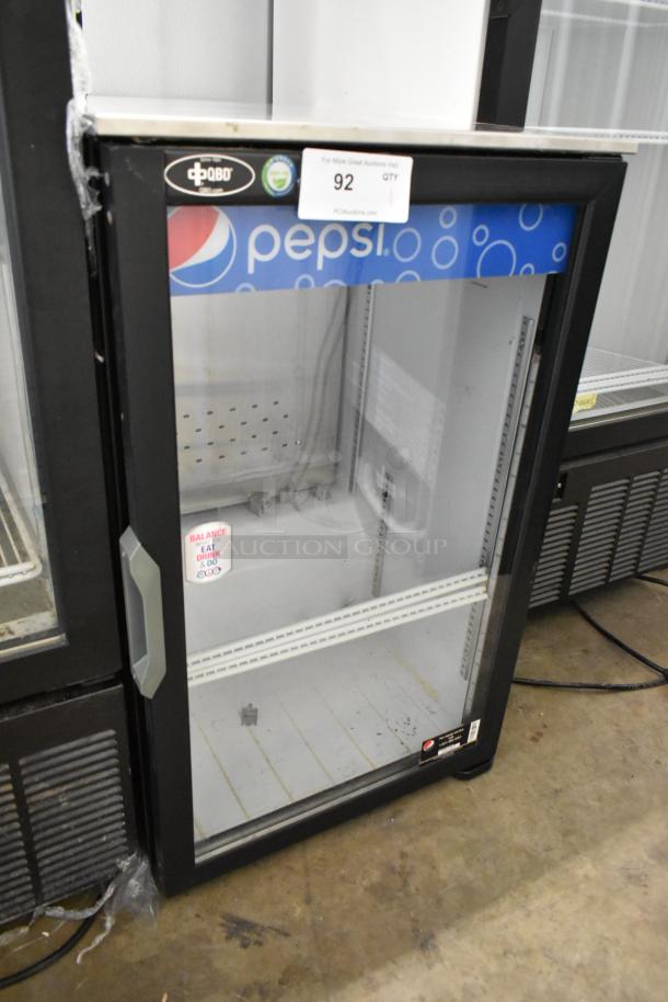 QBD DC6LP-HC single door mini cooler, Pepsi branding, poly coated racks, 115V, visible labels, good condition.