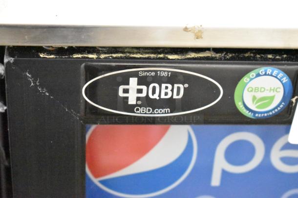 QBD DC6LP-HC mini cooler, single door, black metal, visible labels: QBD logo, "Since 1981," "Go Green QBD-HC."