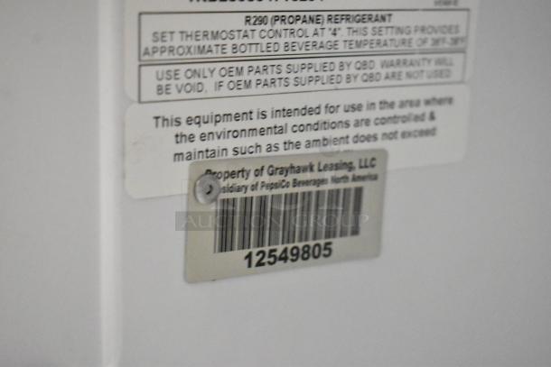 QBD DC6LP-HC mini cooler label details refrigerant, thermostat settings, and OEM parts. Barcode indicates property ownership.