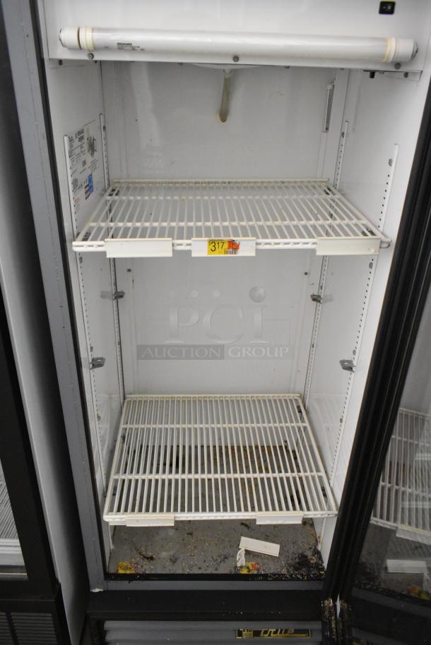 True GDM-12 commercial cooler with single glass door, poly coated racks, and interior labels for model and power specs, used condition.