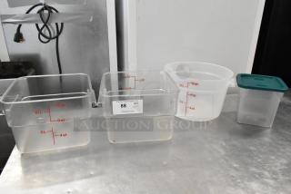 Lot of 4 poly bins, various sizes, marked with quart and liter measurements. Includes one with lid. Good condition.