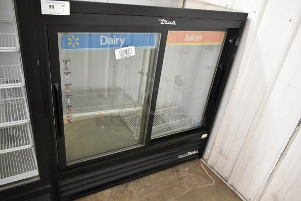 True GDM-41SL-48-HC-LD 2-door cooler merchandiser with poly-coated racks, branded "Dairy" and "Juices." Includes pricing stickers.