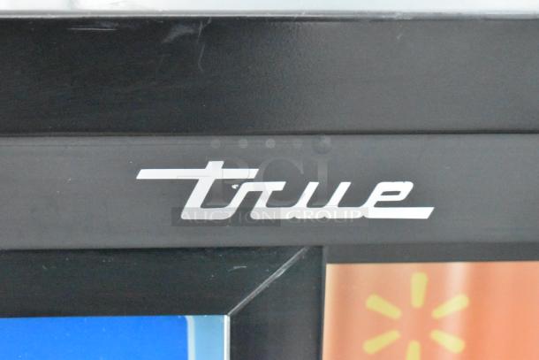 True GDM-41SL-48-HC-LD commercial cooler logo detail on black frame, features spacious interior and durable construction.