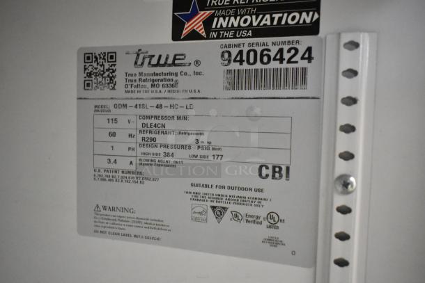 True GDM-41SL-48-HC-LD commercial cooler label, showing model info, voltage, refrigerant type, and serial number.