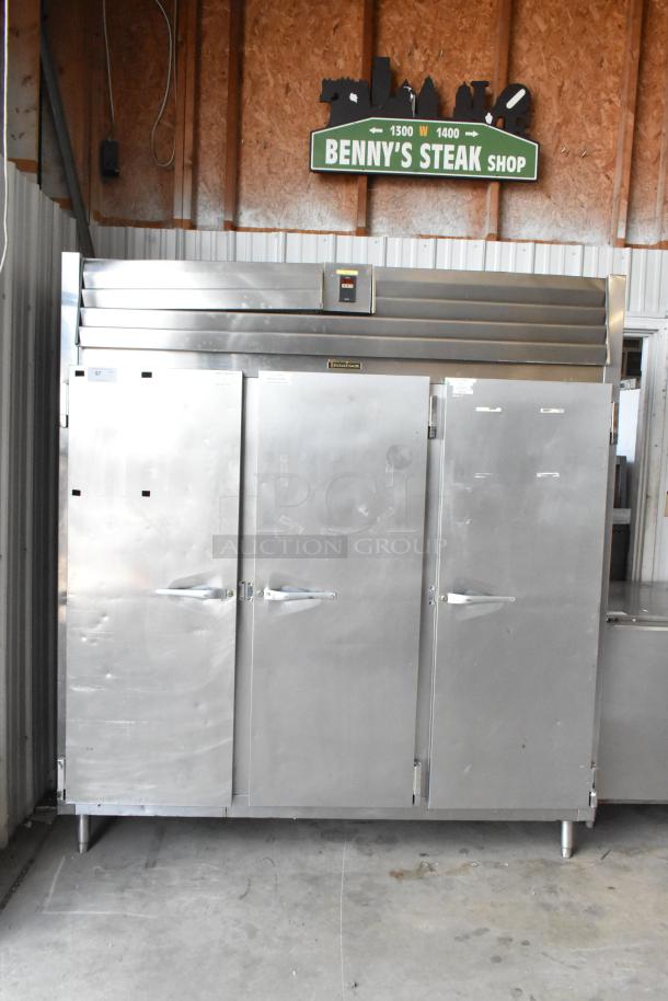Traulsen RL332N-ZBY01 stainless steel 3-door commercial reach-in freezer with poly-coated racks, 115V, 1 phase, in good condition.