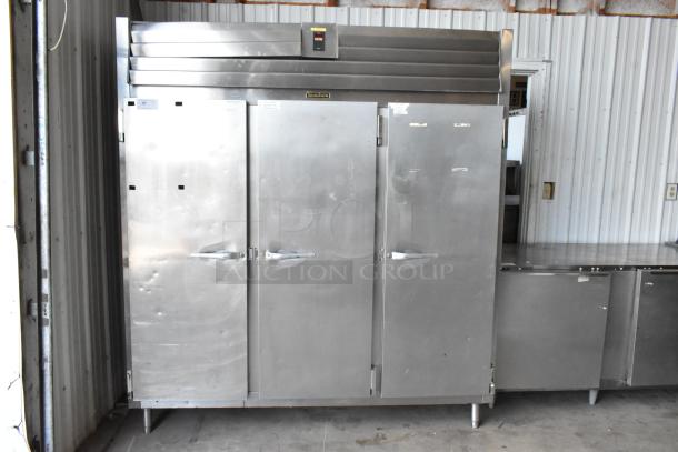 Traulsen RL332N-ZBY01 stainless steel 3-door reach-in freezer with poly-coated racks, commercial-grade, 115V, 1 phase.