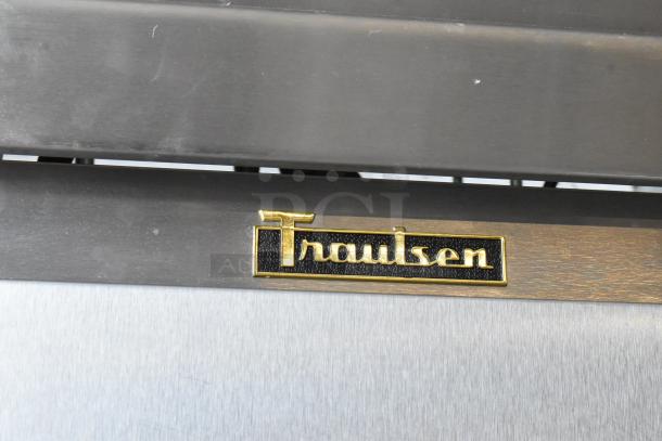 Traulsen RL332N-ZBY01 stainless steel 3-door reach-in freezer with poly-coated racks, 115V, 1-phase, logo shown.