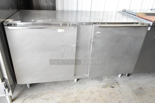 Traulsen ULT60 commercial undercounter freezer, stainless steel, 2-door, 115V, minor surface wear, ideal for kitchen use.