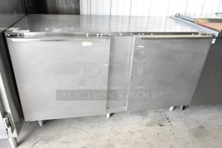 Traulsen ULT60 commercial undercounter freezer, stainless steel, 2-door, 115V, minor surface wear, ideal for kitchen use.