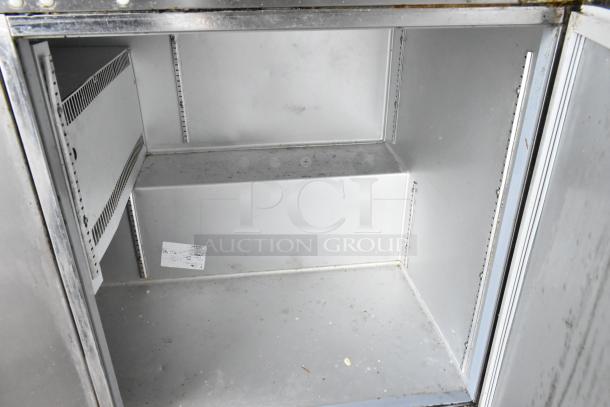 Traulsen ULT60 stainless steel undercounter freezer, 2-door, 115 volts, interior view showing spacious storage, fair condition.
