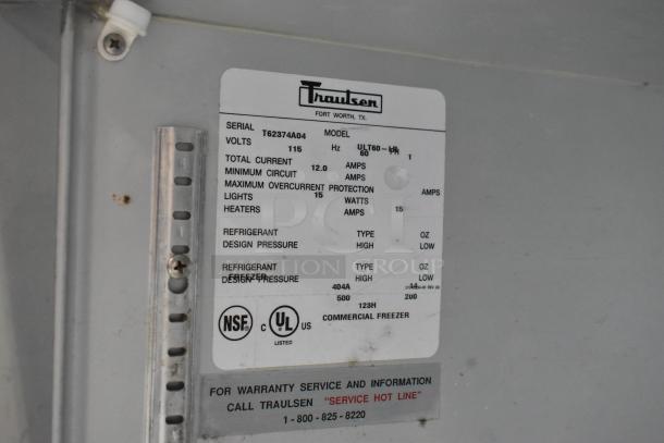 Traulsen ULT60 stainless steel commercial undercounter freezer label showing model, voltage specs, and warranty info.