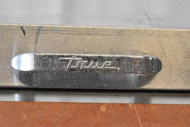 True TSSU-72-18-ST stainless steel commercial pizza prep table logo, showing model identification on the unit.