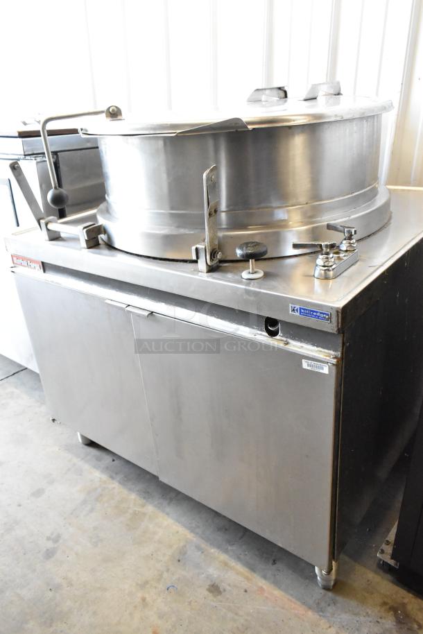 Market Forge MT40 stainless steel 40-gallon steam kettle in good condition, with controls and Market Forge branding visible.