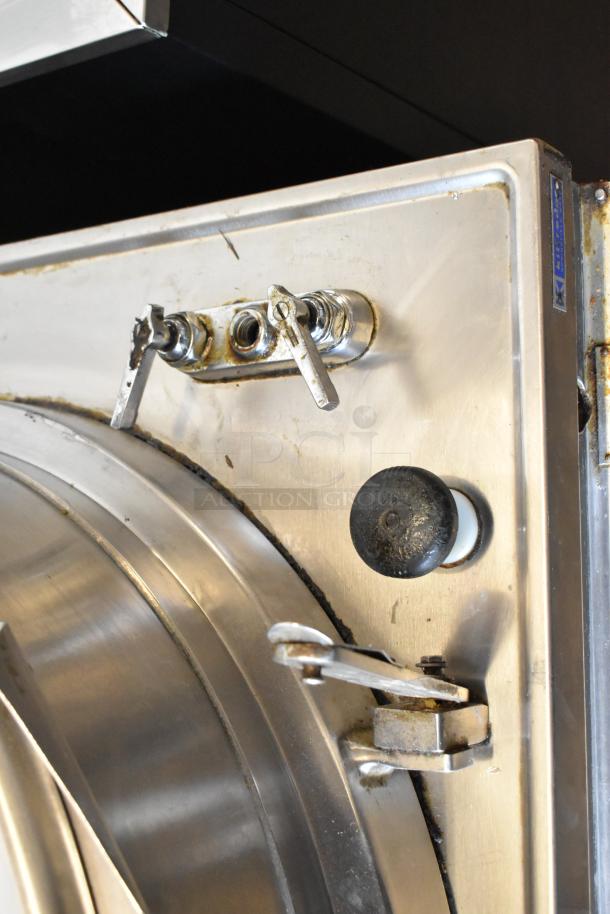 Market Forge MT40 stainless steel 40-gallon steam kettle, commercial floor style, showing control knobs and visible wear.