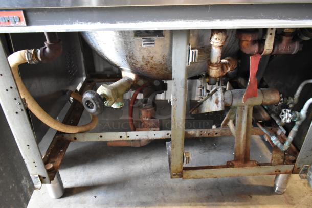 Market Forge MT40 stainless steel 40-gallon steam kettle, floor model. Visible wear, rust, and plumbing connections.