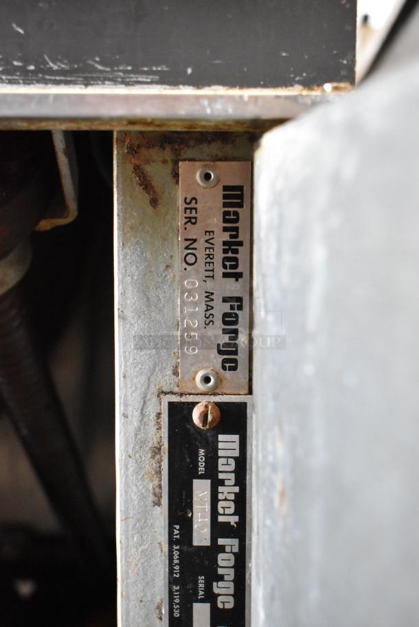 Market Forge MT40 steam kettle nameplate showing model MT40 and serial number 031259, indicating make and specifications.