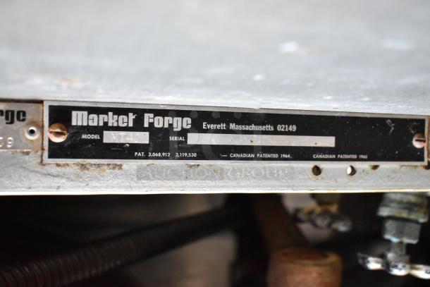 Market Forge MT40 stainless steel steam kettle, 40-gallon capacity. Model MT40 label, patents detailed, used condition.