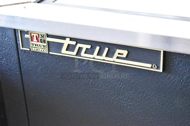 True TD-50-18 Stainless Steel Commercial Back Bar Cooler, 2 Sliding Lids, visible brand logo, 115V, 1 Phase.