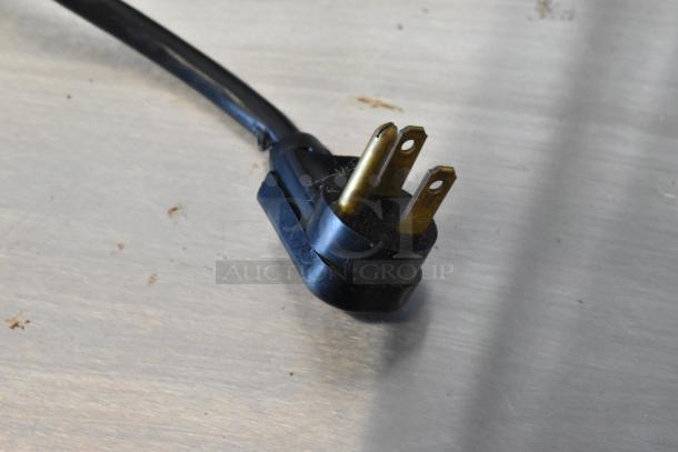 A black three-prong plug from the True TD-50-18 back bar cooler, indicating 115 volts, 1 phase power compatibility.