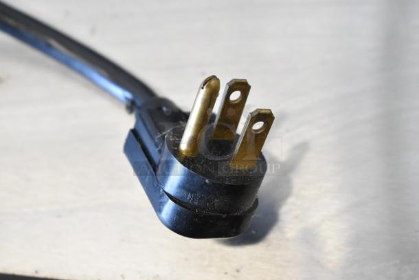 Black and gold three-prong electrical plug for a True TD-50-18 bar cooler, 115 volts, 1 phase.